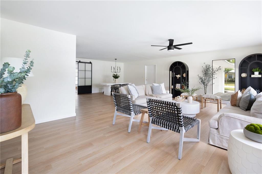 2575 15th Street Vero Beach, FL 32960 - Photo 32 of 36 a living room with furniture a fireplace and a potted plant