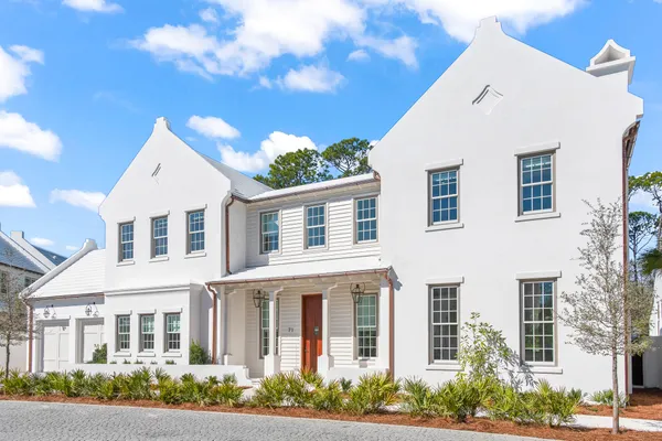 a living room with furniture a fireplace and next to window