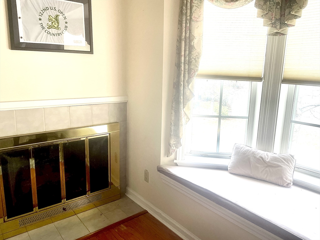 208 Gazebo Circle, Unit 208 Reading, MA 01867 - Photo 9 of 10 a bedroom with a bed and a window
