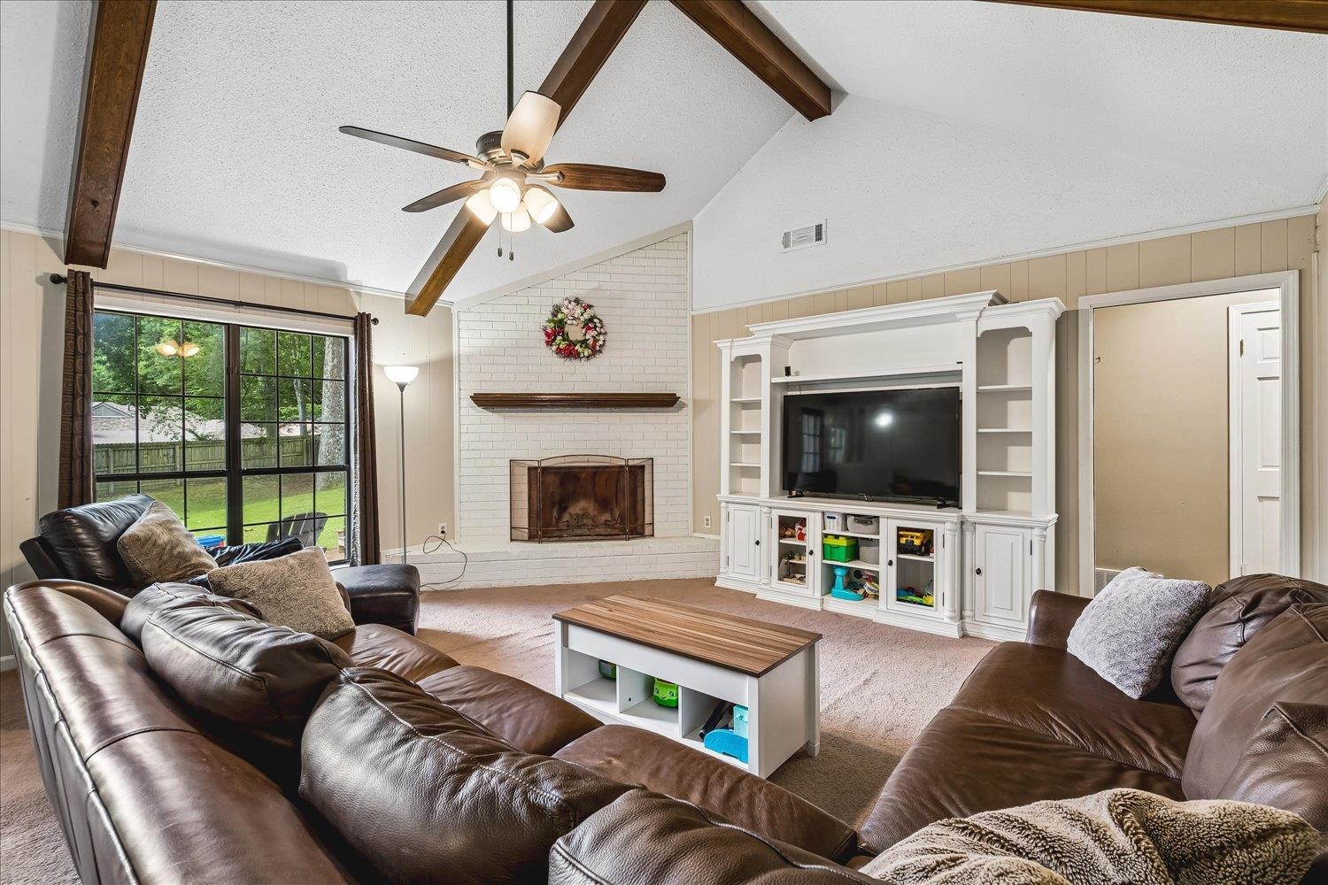 5711 Yale Road Bartlett, TN 38134 - Photo 4 of 29 Vaulted living space featuring exposed wood beams and a ceiling fan