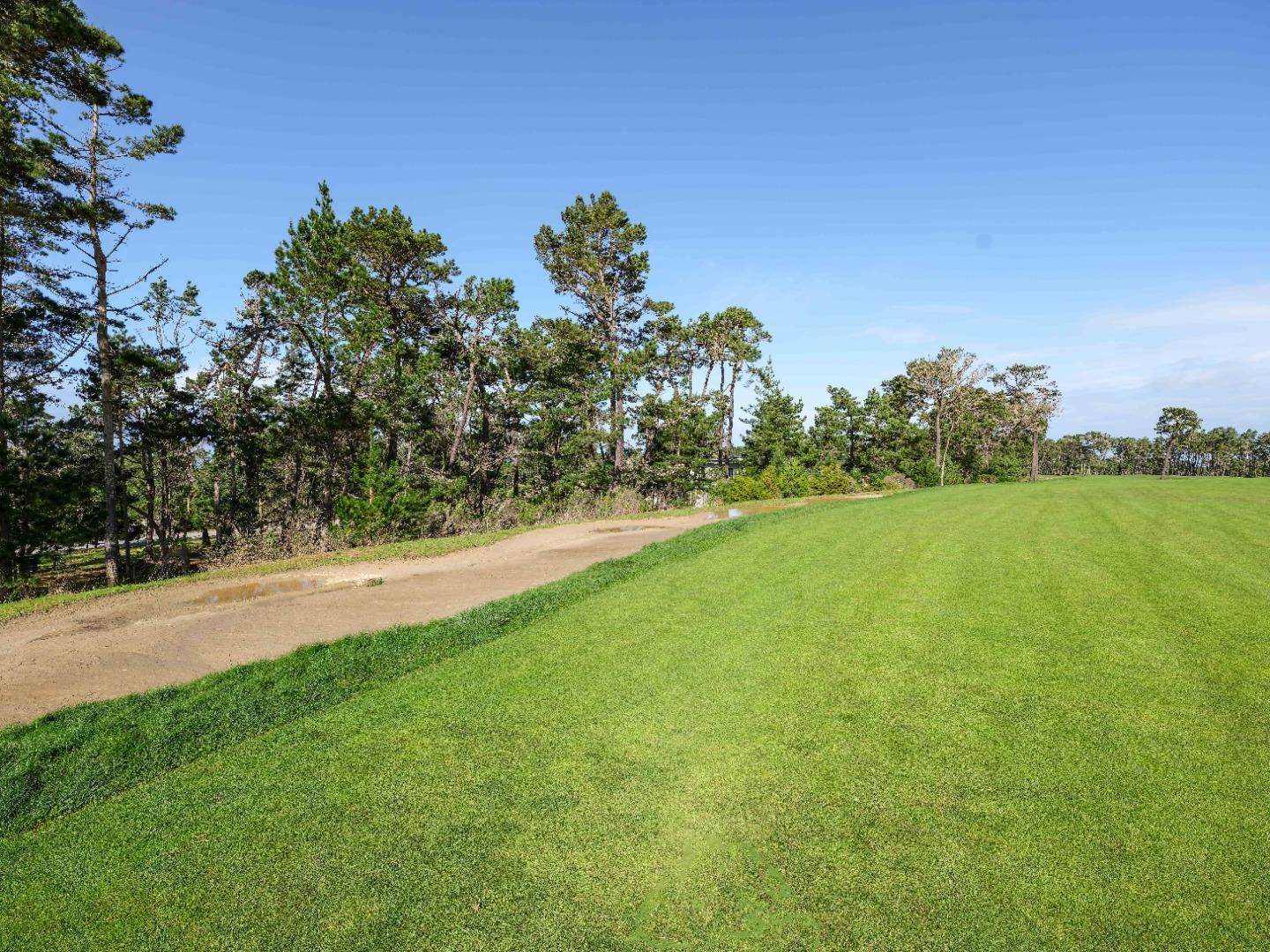 25 Poppy Ln. Lane Pebble Beach, CA 93953 - Photo 9 of 17 a view of a yard with a house in the background