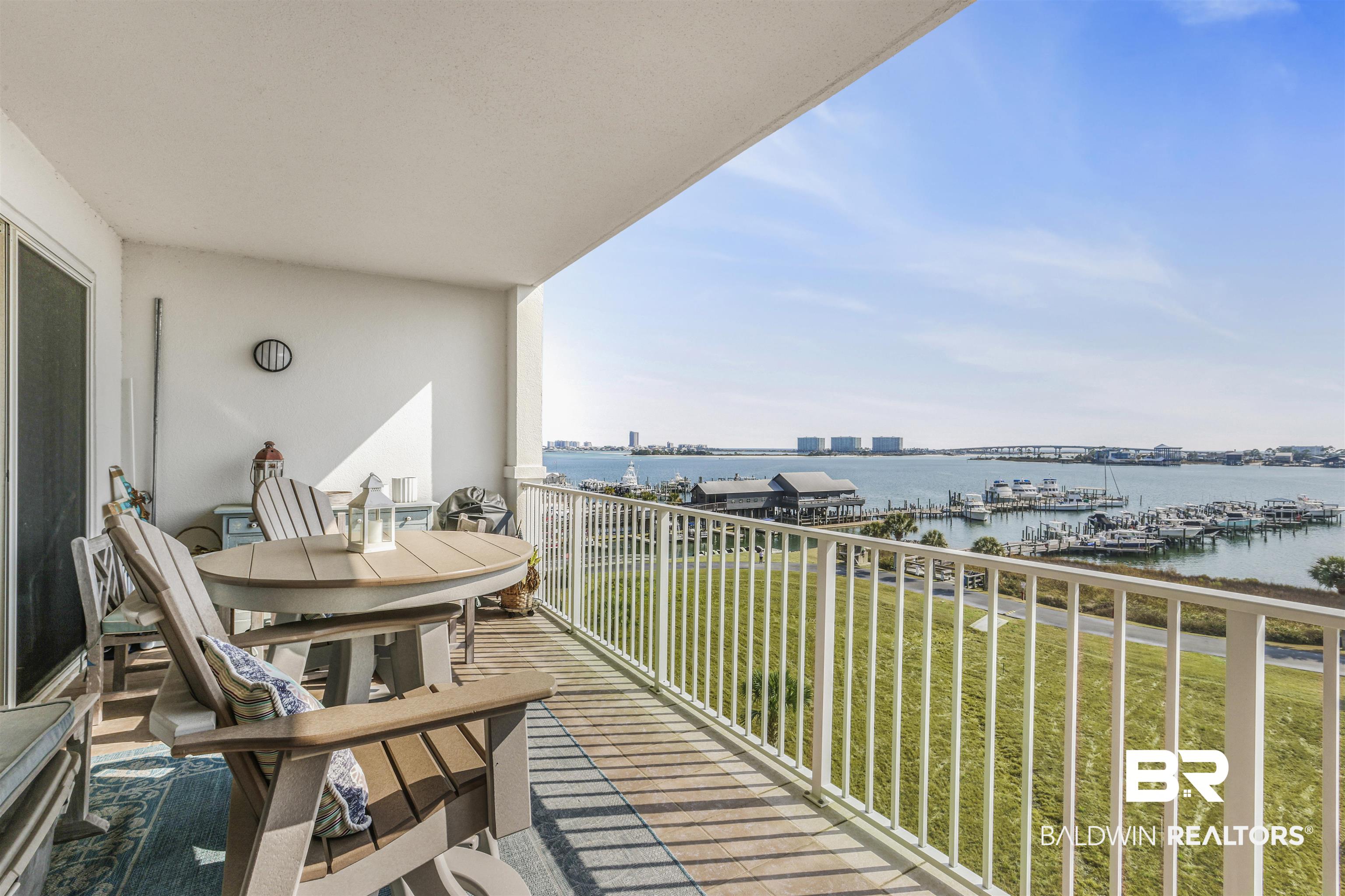 27282 Canal Road, Unit 511 Orange Beach, AL 36561 - Photo 21 of 29 Balcony featuring a water view and view of marina