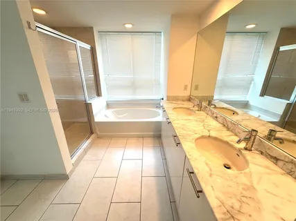 a view of a swimming pool with lounge chairs