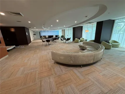 a room with gym equipment and a large window
