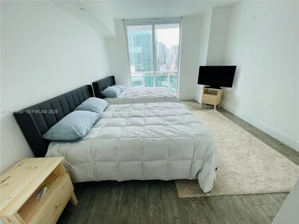 a bedroom with a bed and a couch