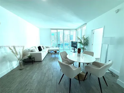 a bedroom with a bed and a television