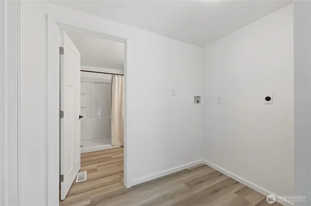 a view of a small space with wooden floor