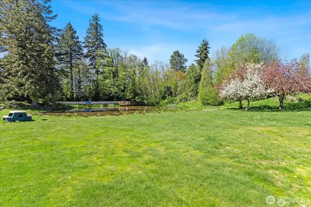 a view of outdoor space with deck and yard