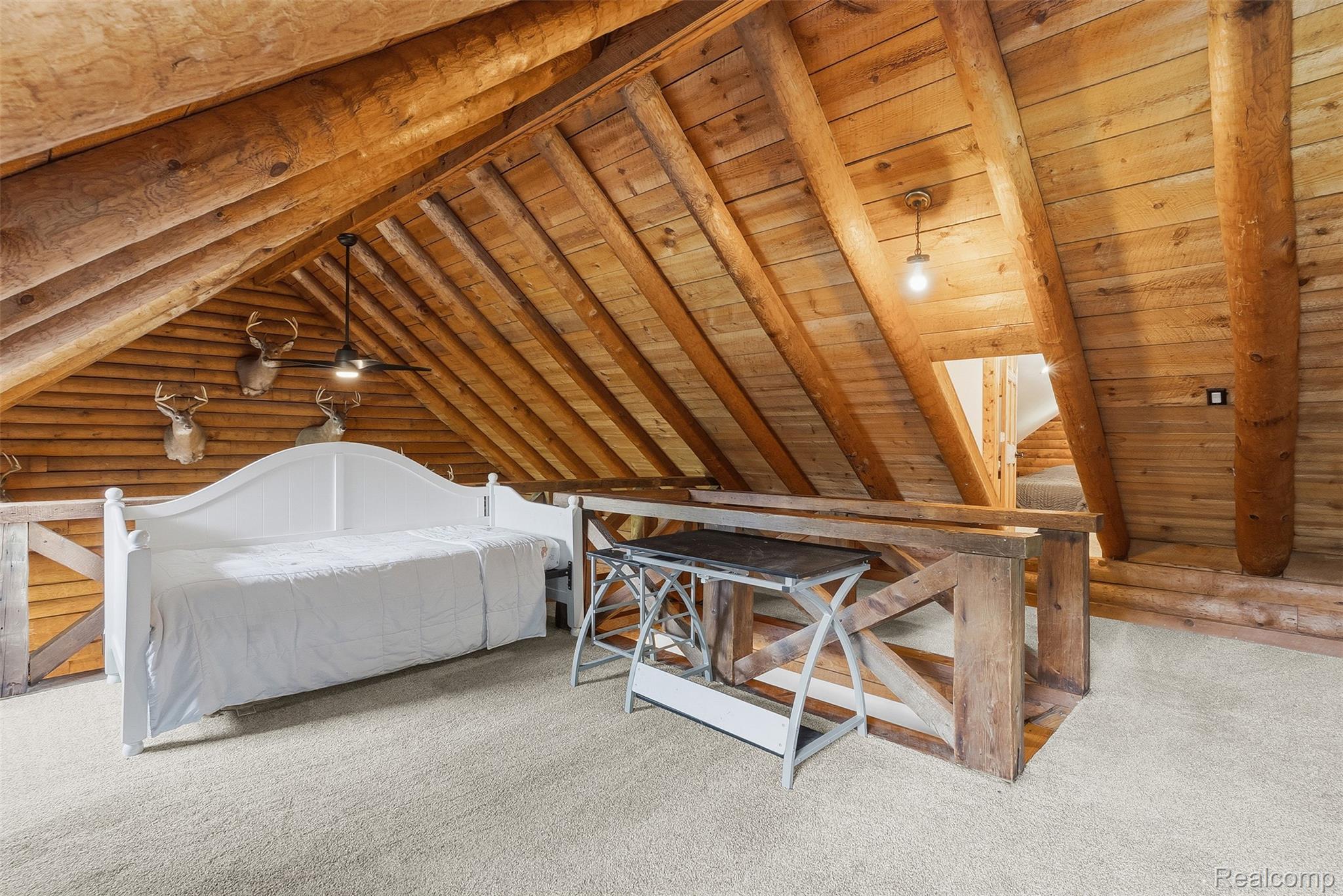 3656 Stanley Road Columbiaville, MI 48421 - Photo 24 of 65 Open loft area featuring exposed wooden beams and a vaulted ceiling