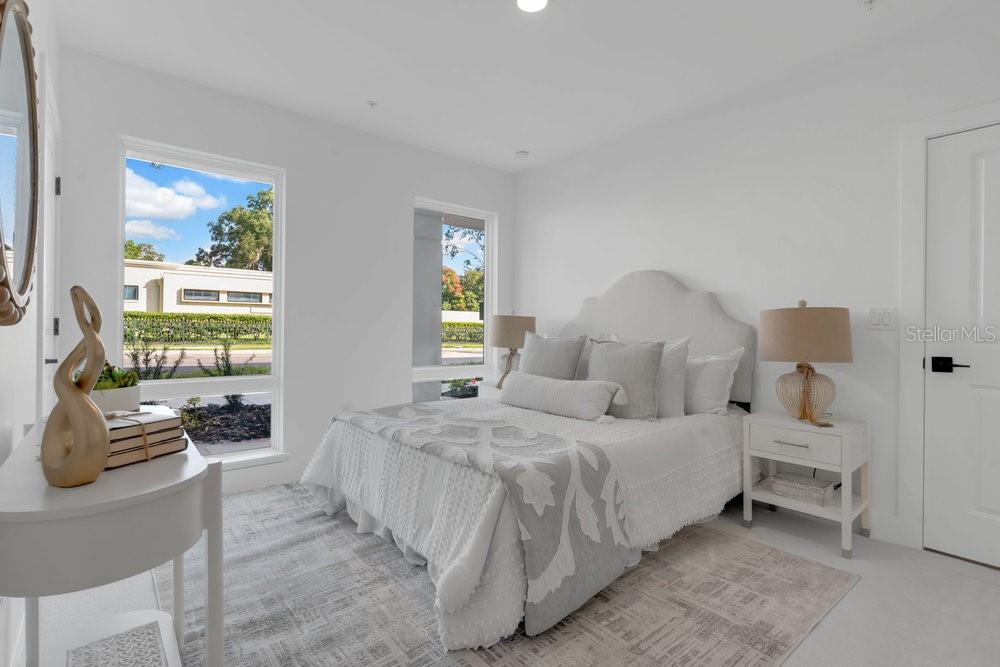 1008 East Robinson Street Orlando, FL 32801 - Photo 2 of 40 a bedroom with a bed and a couch