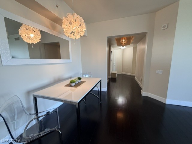 2777 Paradise Road, Unit 807 Las Vegas, NV 89109 - Photo 33 of 61 Clean lines and dark wood flooring define this elegant dining area, complete with a distinctive pendant light fixture.