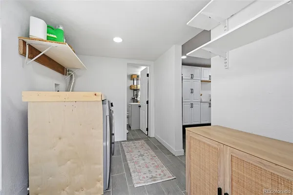 a view of hallway with walk in closet and bedroom