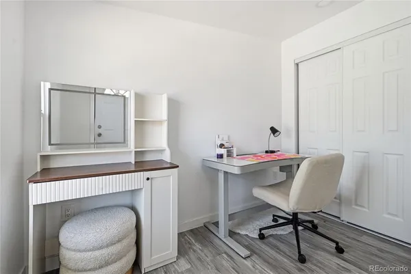 a bedroom with furniture and a window