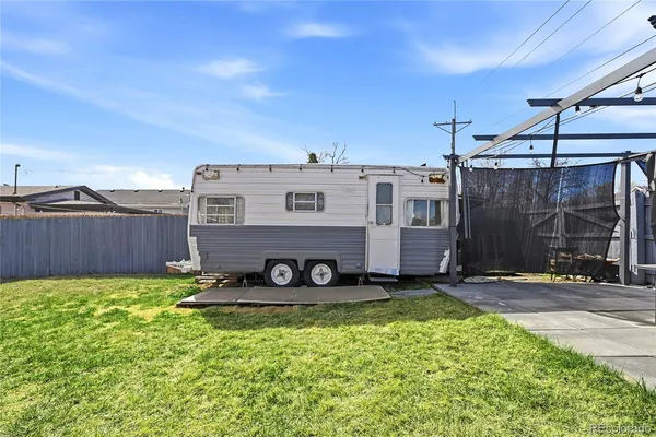 a kitchen with stainless steel appliances granite countertop a refrigerator and a stove