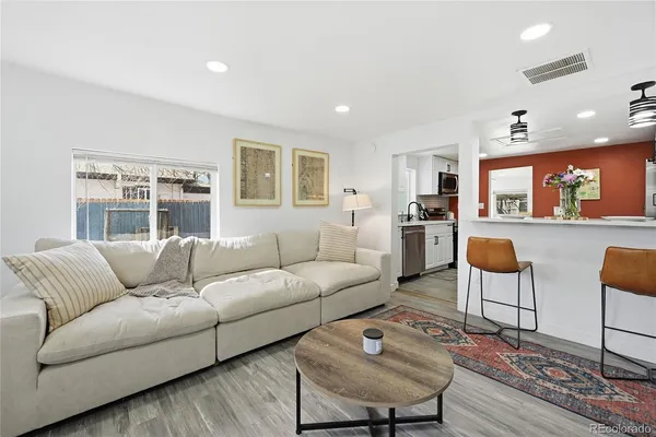 a living room with furniture and a table