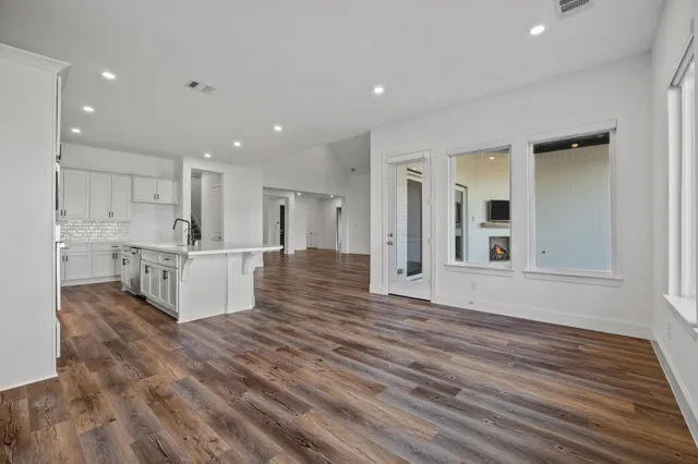 an aerial view of residential houses with outdoor space and swimming pool
