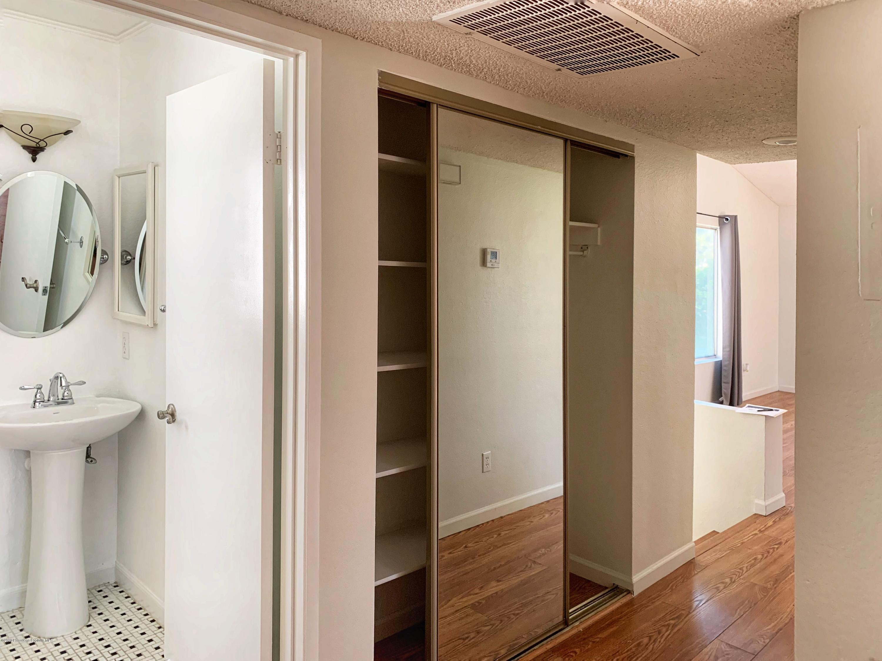 10245 Chaparral Way, Unit E Rancho Cucamonga, CA 91730 - Photo 14 of 31 a bathroom with a sink and mirror