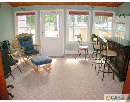 397 Chain O' Hills Road Colonia, NJ 07067 - Photo 3 of 10 a living room with furniture and a large window