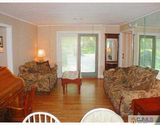 397 Chain O' Hills Road Colonia, NJ 07067 - Photo 4 of 10 a living room with furniture window and wooden floor