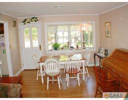 397 Chain O' Hills Road Colonia, NJ 07067 - Photo 5 of 10 a outdoor dining space with furniture window and wooden floor