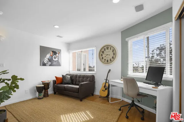 a bathroom with a sink vanity granite toilet and shower