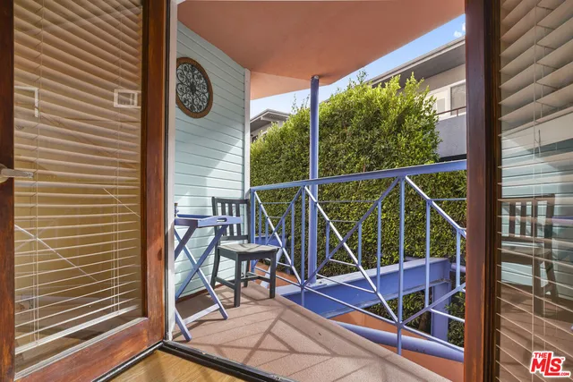 a bathroom with a sink shower and a mirror