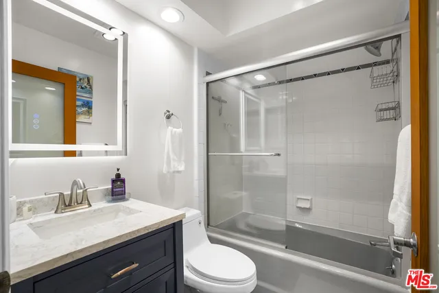 a view of a porch with a door and a balcony