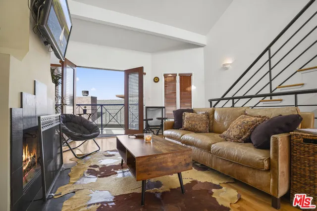 a bedroom with a bed and a television