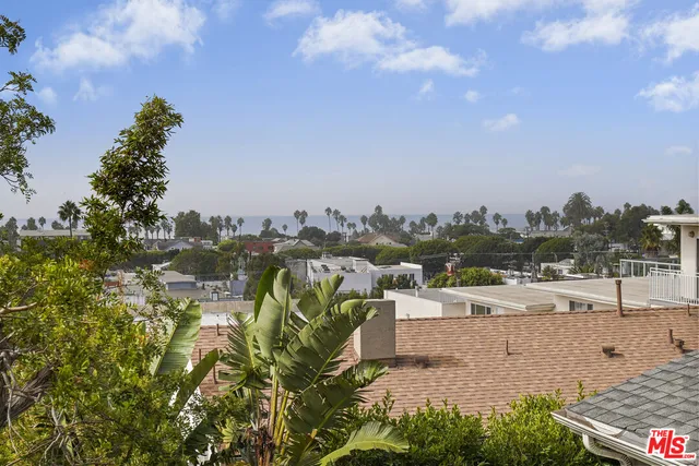 a kitchen with a sink appliances and cabinets