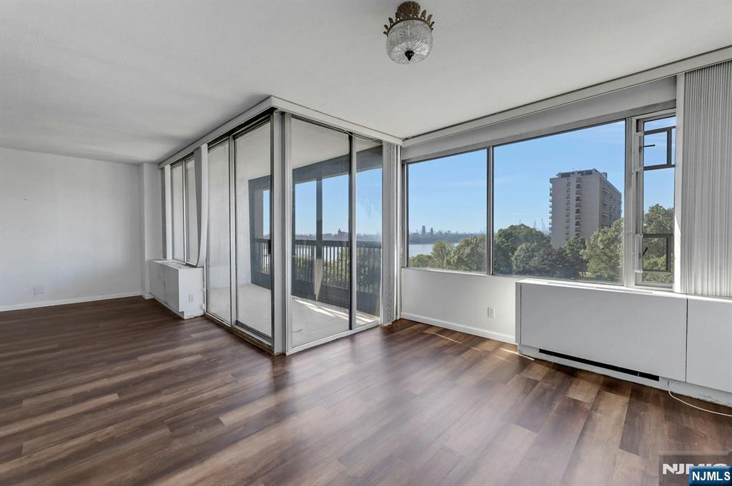 5 Horizon Road, Unit 503 Fort Lee, NJ 07024 - Photo 13 of 45 a view of a big room with wooden floor and windows