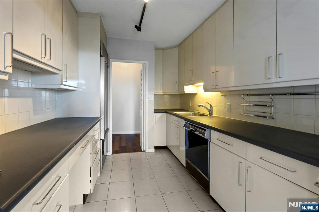 5 Horizon Road, Unit 503 Fort Lee, NJ 07024 - Photo 18 of 45 a kitchen with granite countertop cabinets and steel stainless steel appliances