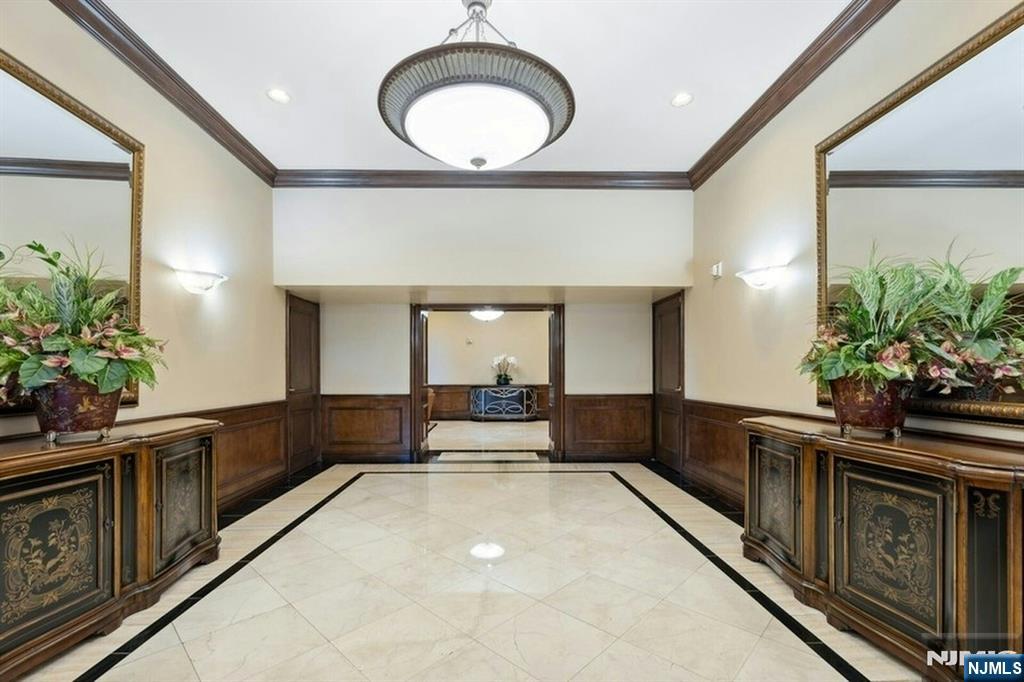 5 Horizon Road, Unit 503 Fort Lee, NJ 07024 - Photo 33 of 45 a living room with furniture a potted plant and a large window