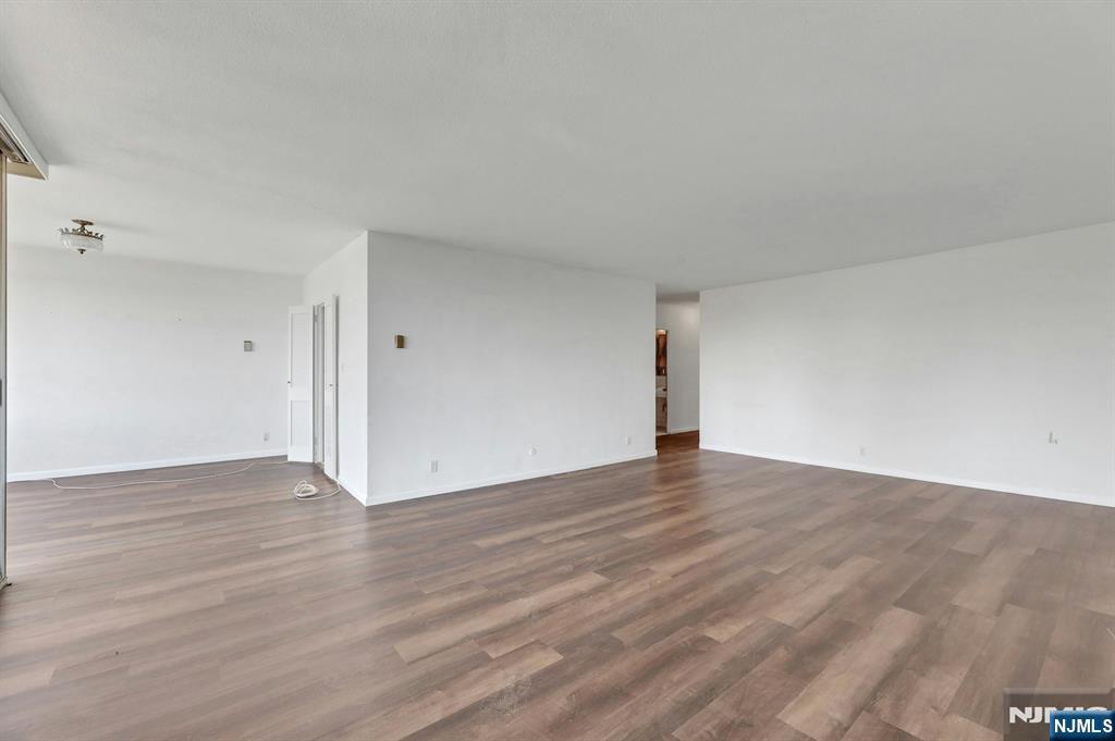 5 Horizon Road, Unit 503 Fort Lee, NJ 07024 - Photo 9 of 45 a view of an empty room and wooden floor