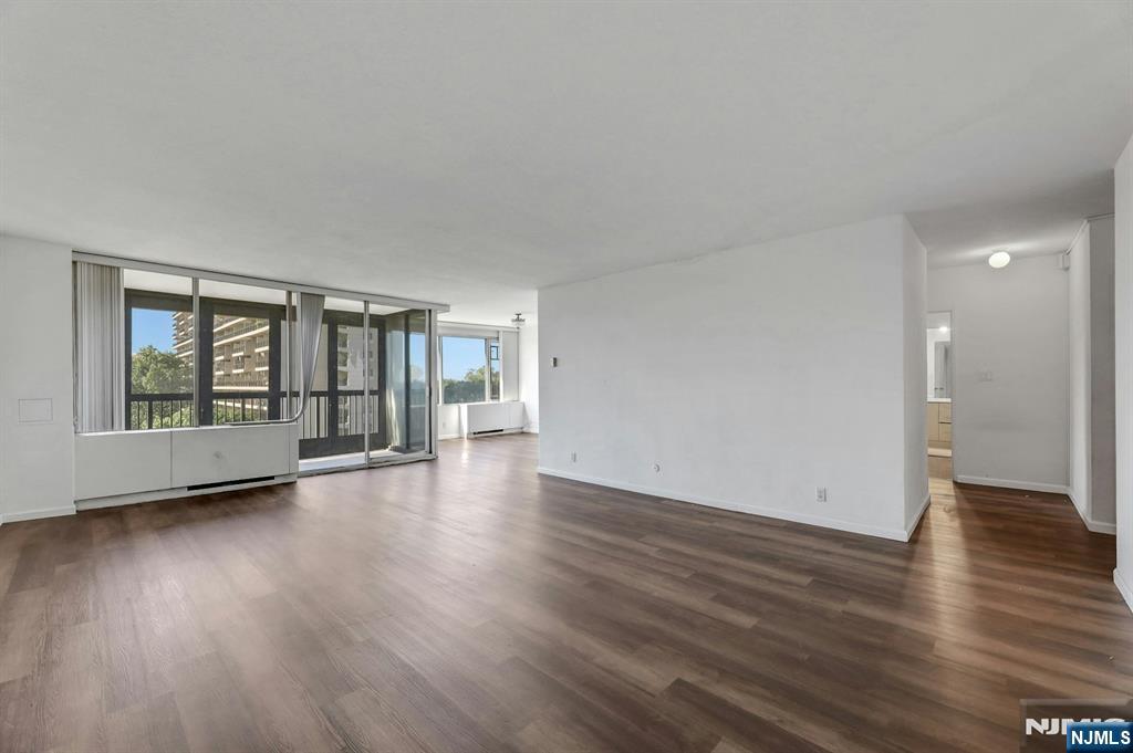 5 Horizon Road, Unit 503 Fort Lee, NJ 07024 - Photo 10 of 45 a view of an empty room with wooden floor and a window