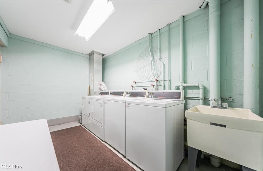 20333 Detroit Road, Unit 510B Rocky River, OH 44116 - Photo 9 of 9 Laundry room featuring washer and dryer and sink