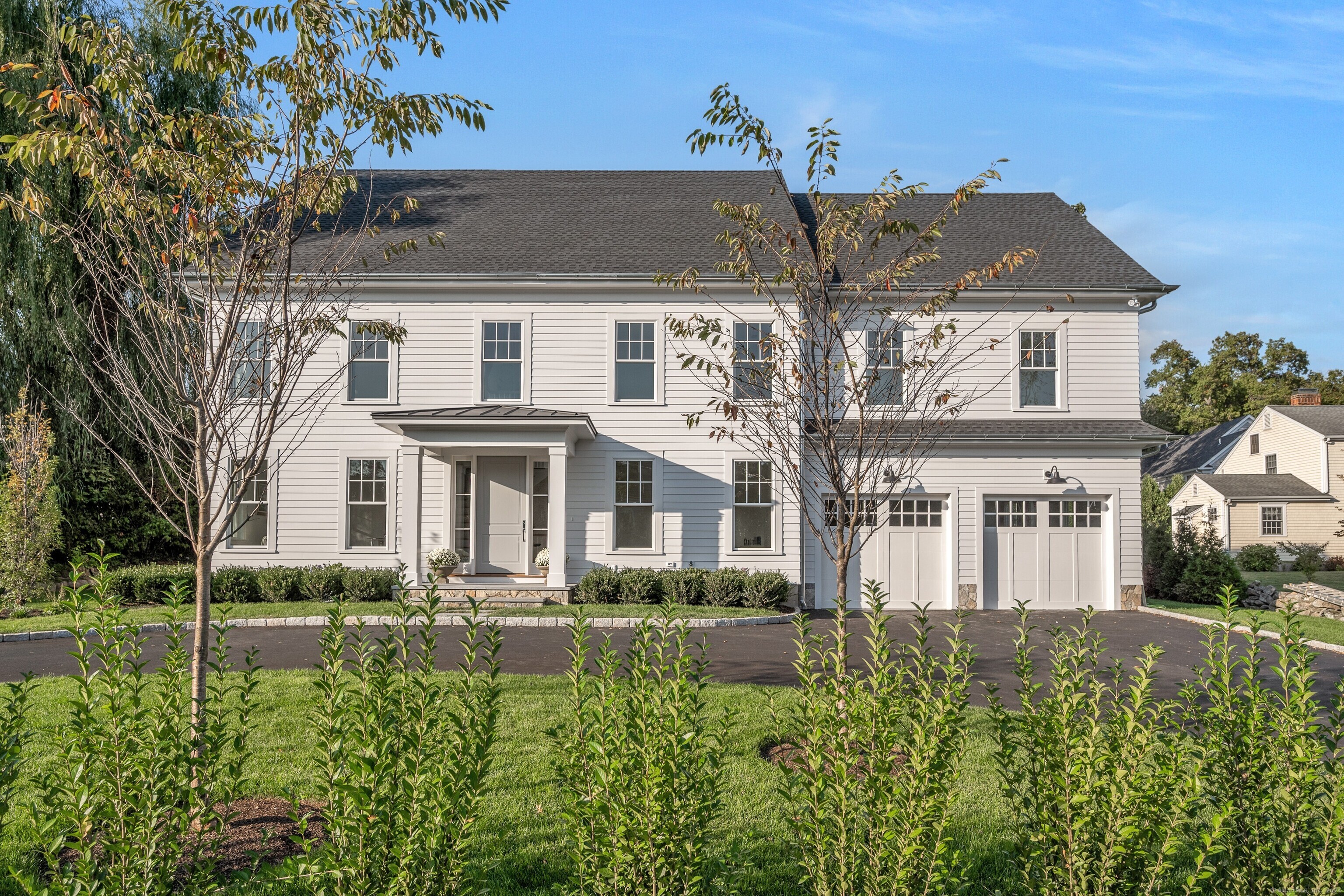 a front view of a house with a yard