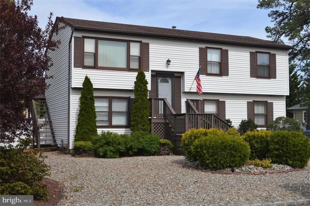 131 Club House Road Brick, NJ 08723 - Photo 1 of 20 a front view of a house with plants