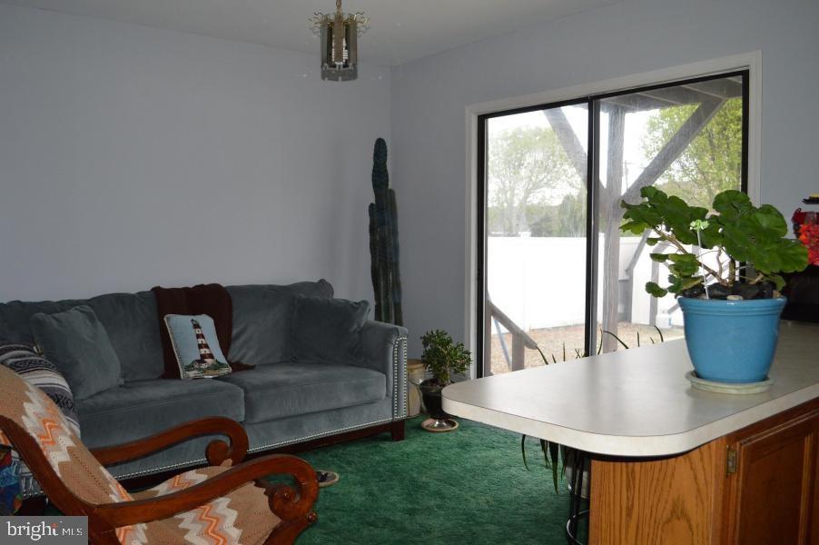131 Club House Road Brick, NJ 08723 - Photo 13 of 20 a living room with furniture and a potted plant
