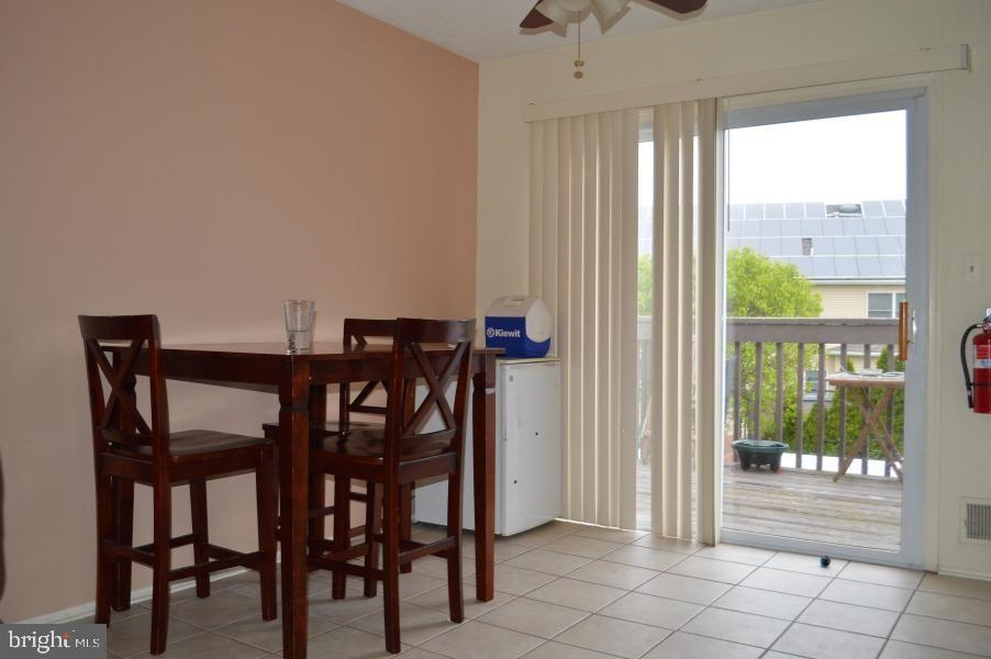 131 Club House Road Brick, NJ 08723 - Photo 7 of 20 a view of a dining room with furniture and a window