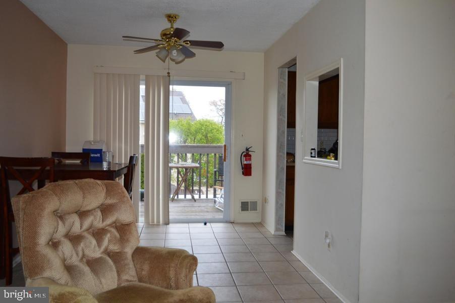 131 Club House Road Brick, NJ 08723 - Photo 8 of 20 a living room with furniture and a chandelier