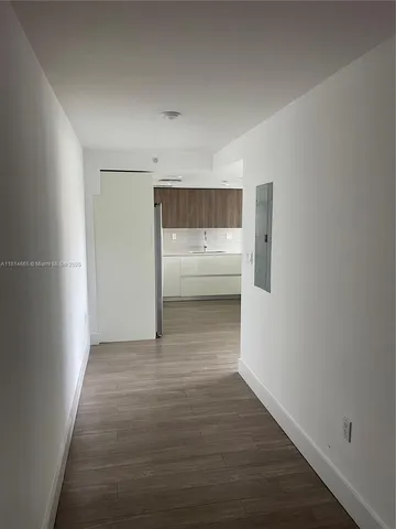 a view of room and wooden floor