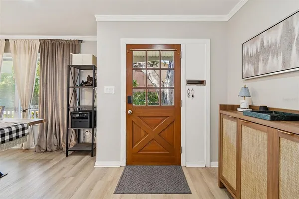 a view of entryway with wooden floor and door
