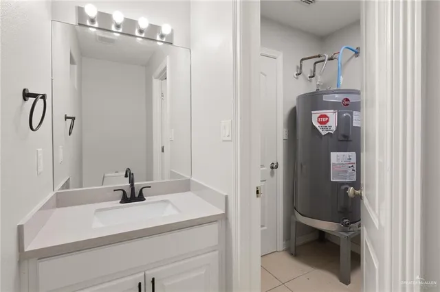a bathroom with a sink and mirror
