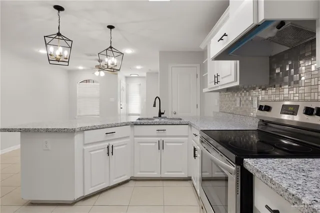 a kitchen with a sink and cabinets