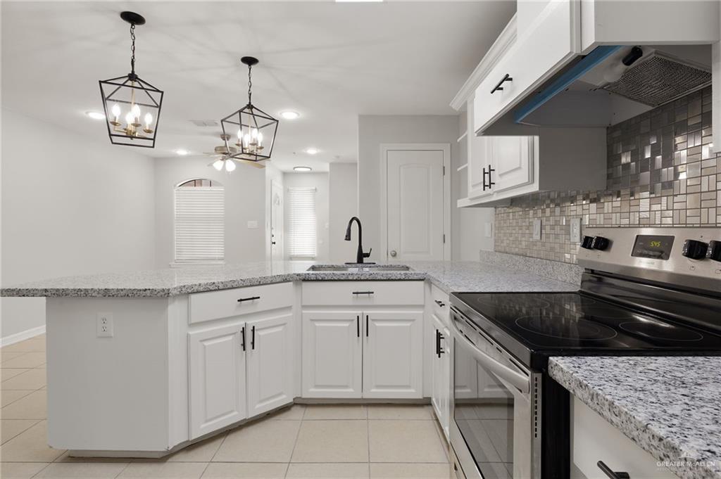 213 South 49th Street, Unit 2 McAllen, TX 78501 - Photo 5 of 23 a kitchen with a sink and cabinets