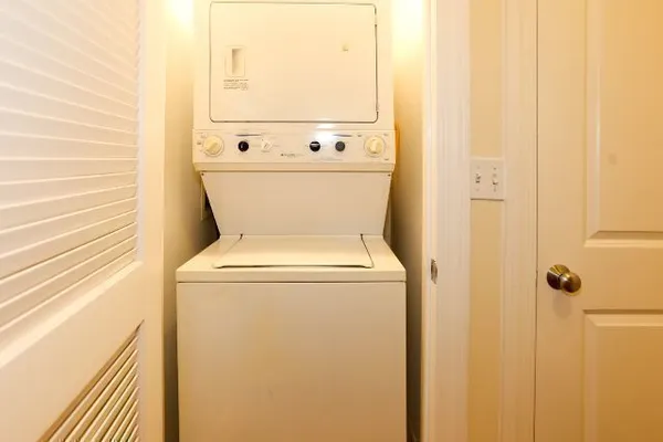 a view of bathroom with washer and dryer