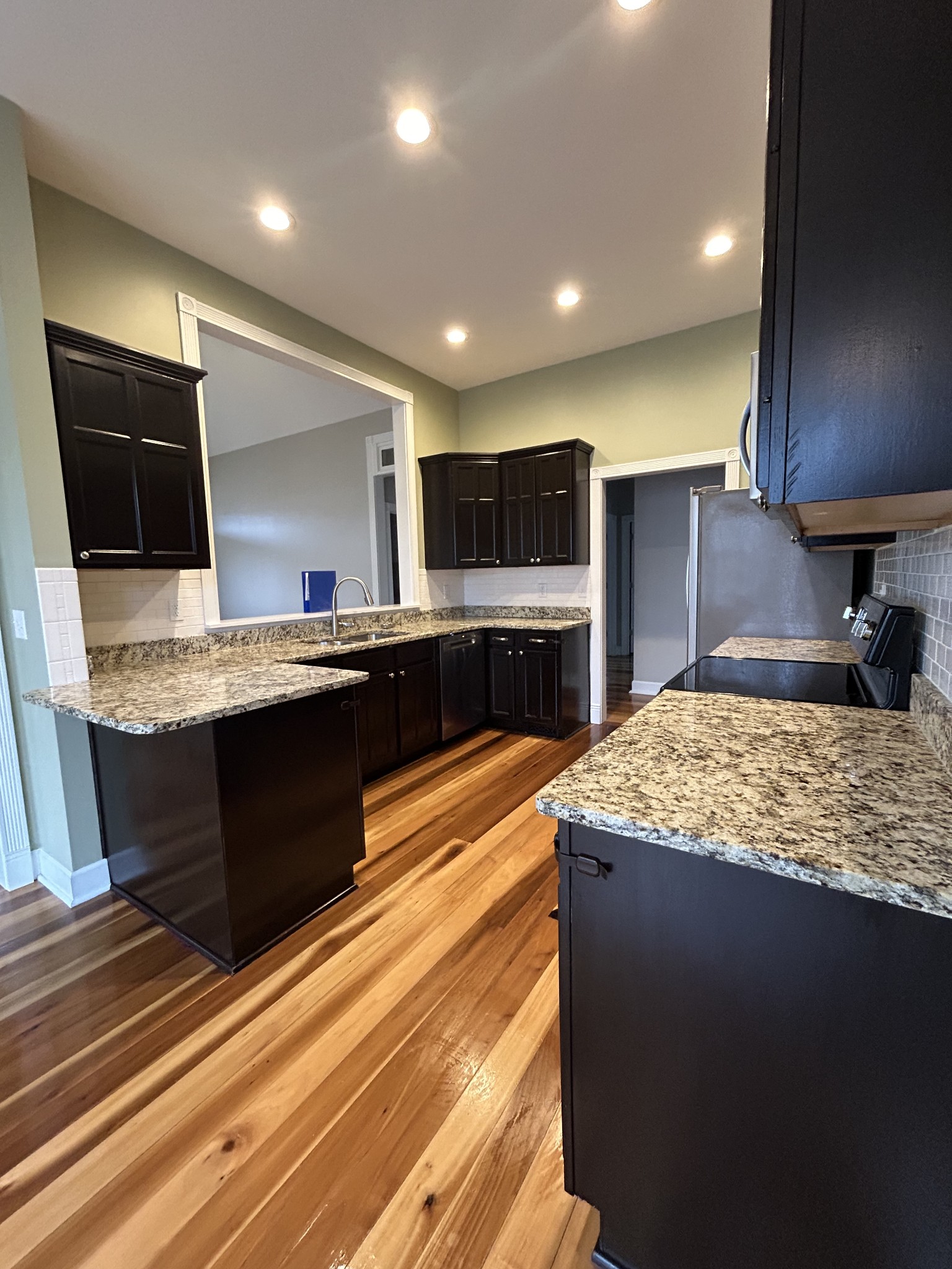 834 Blakemore Road Dickson, TN 37055 - Photo 14 of 26 a large kitchen with kitchen island a sink stainless steel appliances and cabinets
