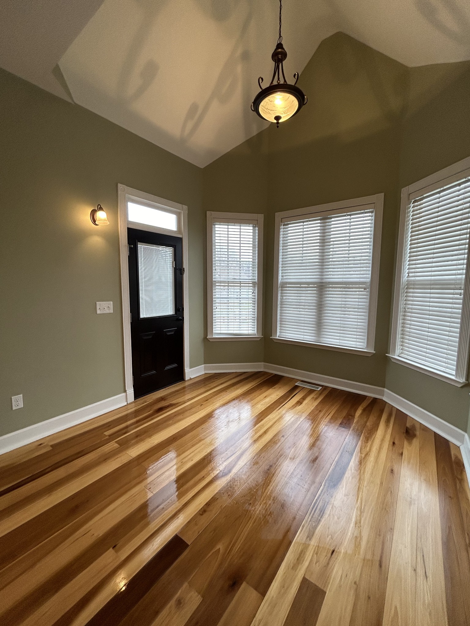 834 Blakemore Road Dickson, TN 37055 - Photo 15 of 26 a view of an empty room with wooden floor and a window