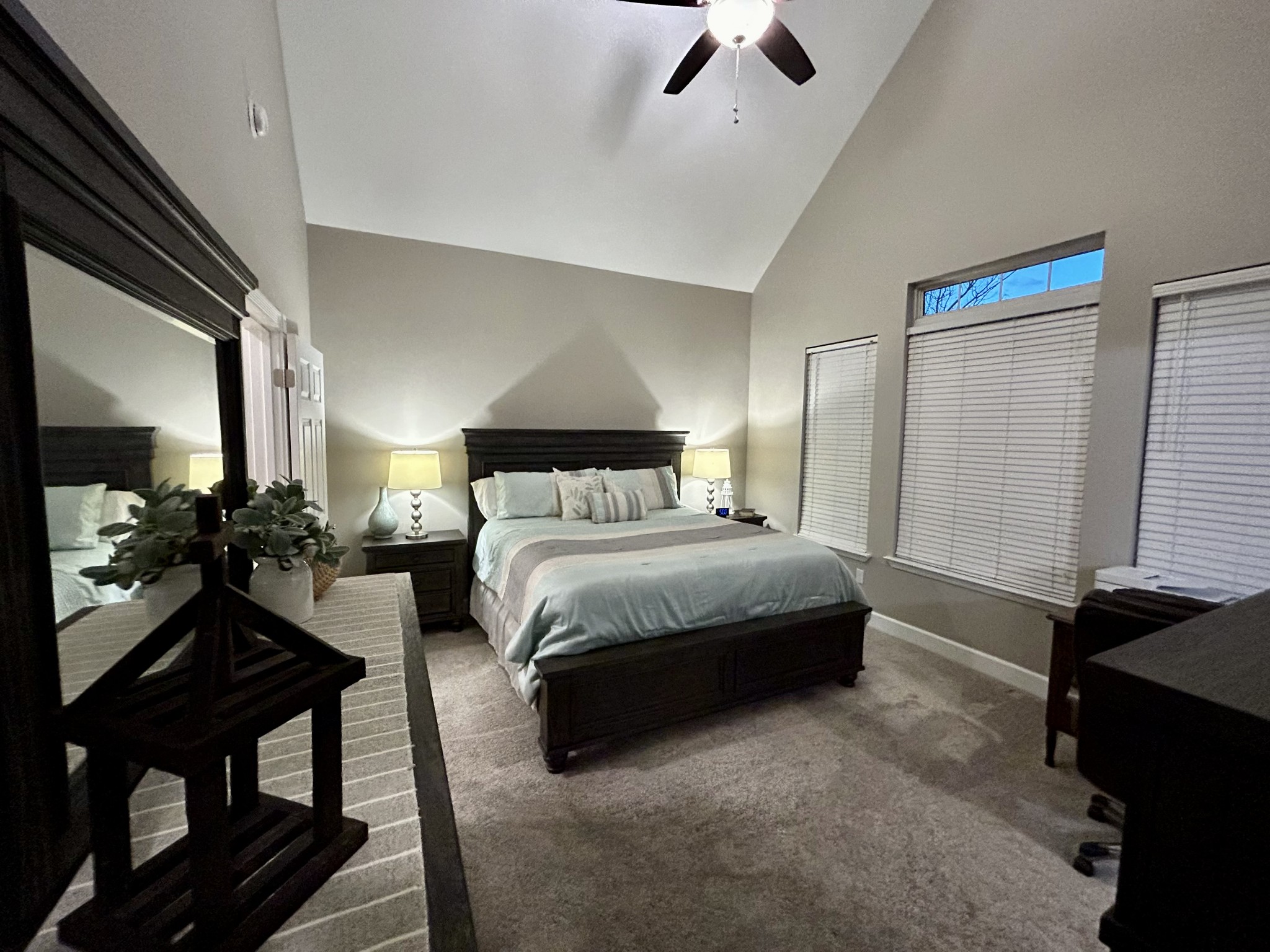 834 Blakemore Road Dickson, TN 37055 - Photo 17 of 26 a bedroom with a bed and a chandelier