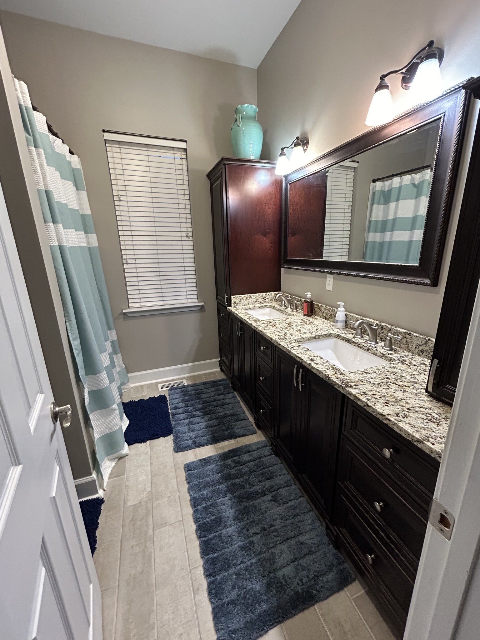 834 Blakemore Road Dickson, TN 37055 - Photo 19 of 26 a bathroom with a granite countertop sink and a mirror